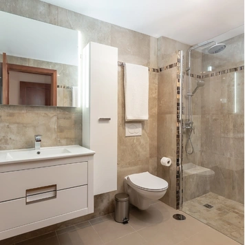 Contemporary bathroom renovation with tile shower and storage in Los Angeles by Trusted Contractor LA