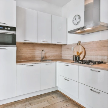 Contemporary kitchen renovation with custom cabinets and backsplash in Los Angeles by Trusted Contractor LA